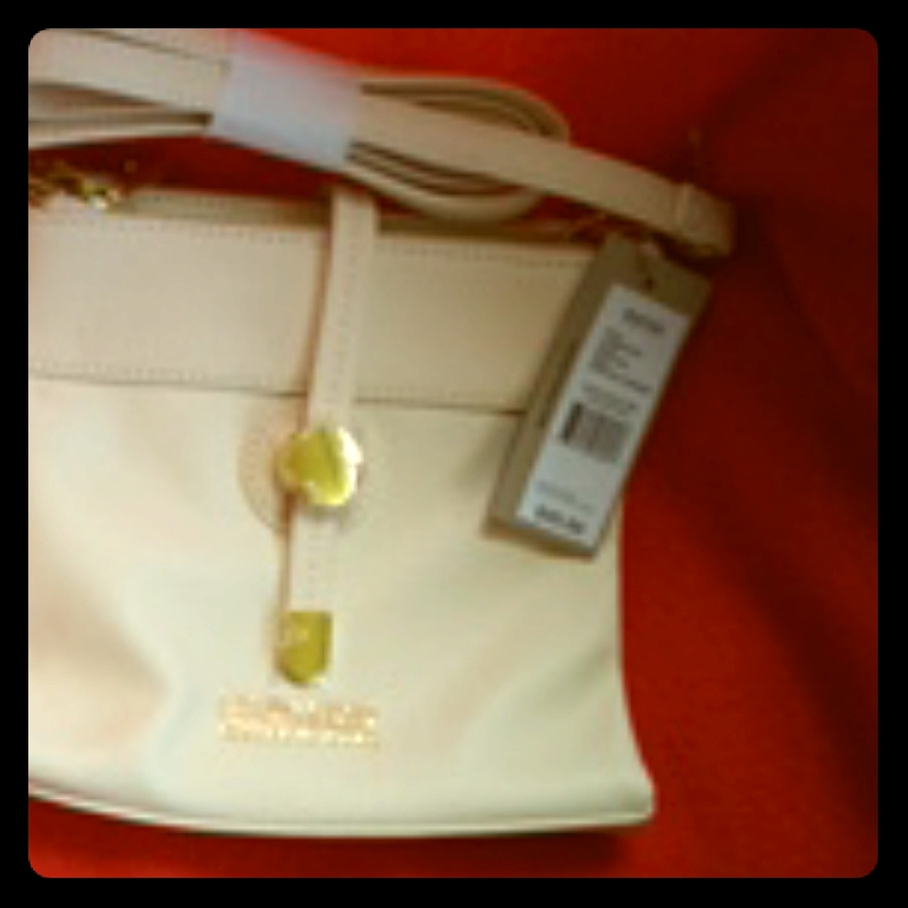 Purse cream color with gold accents